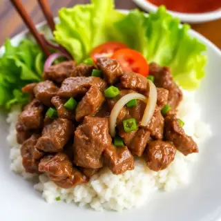 25. Filet Mignon Loc Lak Over Rice